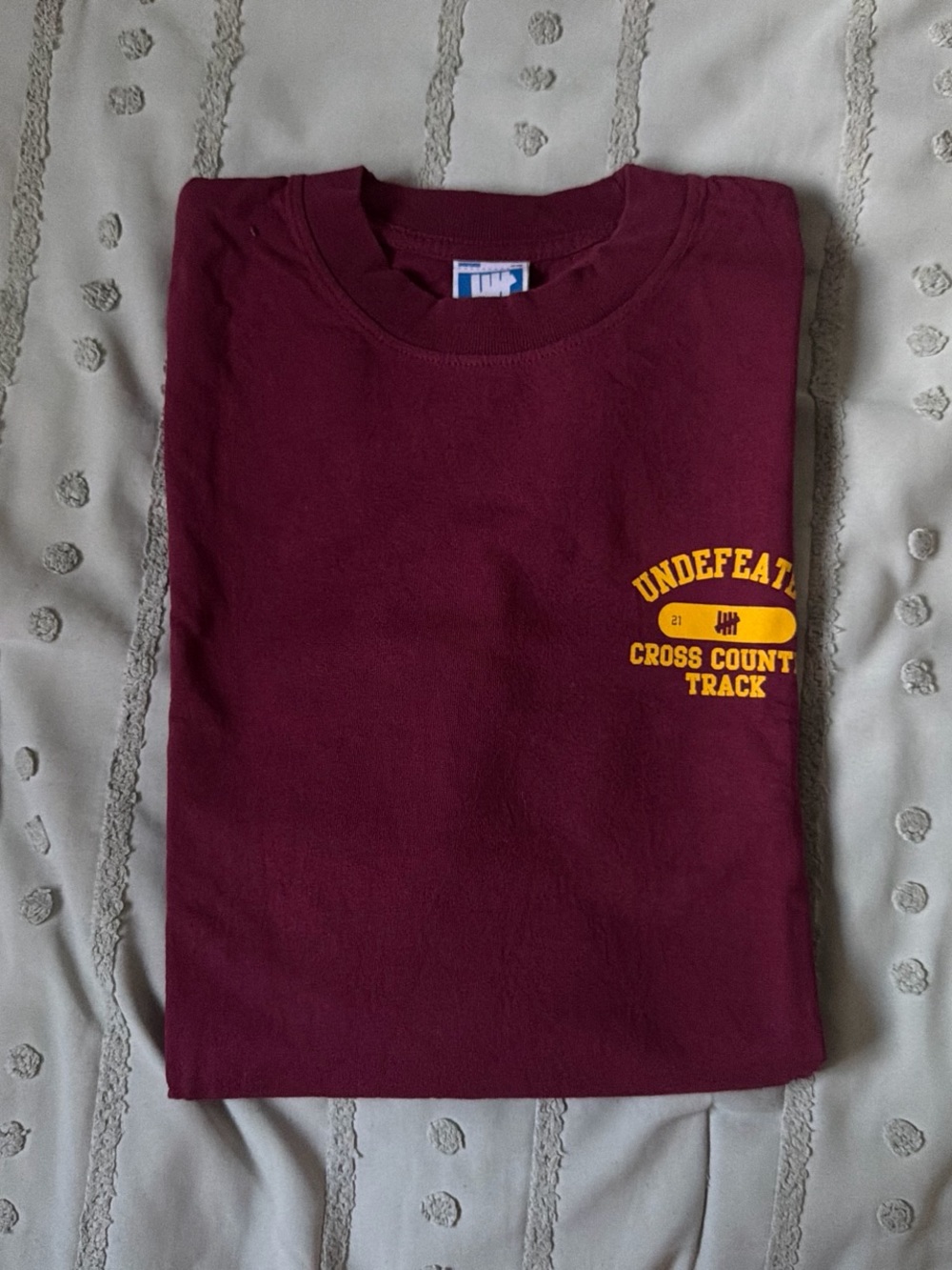 Undefeated Maroon Tee with Yellow Cross Country Track Logo